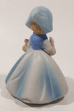 Vintage Girl and Blue and White Floral Dress Wearing a Bonnet and Holding a Basket 4 1/2" Tall Porcelain Figurine