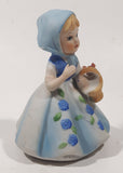 Vintage Girl and Blue and White Floral Dress Wearing a Bonnet and Holding a Basket 4 1/2" Tall Porcelain Figurine