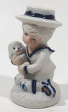 Vintage Brinns Blue and White French Colonial Boy Holding White Puppy Dog 4" Tall Porcelain Figurine
