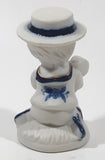 Vintage Brinns Blue and White French Colonial Boy Holding White Puppy Dog 4" Tall Porcelain Figurine