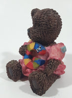 Dark Brown Teddy Bear Sitting In Pink Dress Holding Snake Formed As The Letter G 3 1/2" Tall Resin Figurine