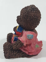 Dark Brown Teddy Bear Sitting In Pink Dress Holding Snake Formed As The Letter G 3 1/2" Tall Resin Figurine