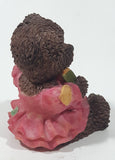 Dark Brown Teddy Bear Sitting In Pink Dress Holding Snake Formed As The Letter G 3 1/2" Tall Resin Figurine