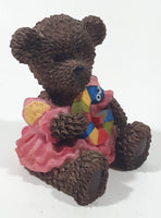 Dark Brown Teddy Bear Sitting In Pink Dress Holding Snake Formed As The Letter G 3 1/2" Tall Resin Figurine