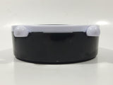 Black and White Round 5 1/4" Plastic Battery Operated Footed Desktop Alarm Clock