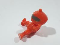 Orange Character with Helmet In Riding Pose With Arms Up 1 7/8" Tall Plastic Toy Figure