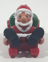 Santa Claus On His Sled with Bag of Presents 2 5/8" Long Toy Figure