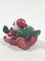 Santa Claus On His Sled with Bag of Presents 2 5/8" Long Toy Figure