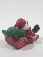 Santa Claus On His Sled with Bag of Presents 2 5/8" Long Toy Figure