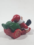 Santa Claus On His Sled with Bag of Presents 2 5/8" Long Toy Figure