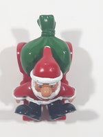 Santa Claus On His Sled with Bag of Presents 2 5/8" Long Toy Figure