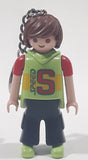 2006 Geobra Playmobil Speed S Boy in Green and Red with Black Pants 3" Tall Toy Figure Keychain