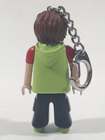 2006 Geobra Playmobil Speed S Boy in Green and Red with Black Pants 3" Tall Toy Figure Keychain