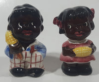 Rare Antique Black Americana Boy and Girl Holding Corn Cobs Cork Plug Ceramic Salt and Pepper Shakers