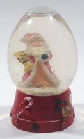 Santa Claus 4 1/4" Tall Red Resin Snow Globe