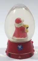 Santa Claus 4 1/4" Tall Red Resin Snow Globe