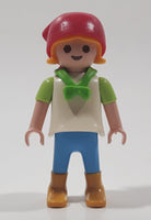 1992 Geobra Playmobil Girl with Blonde Hair Red Bonnet in White and Green Top and Blue Pants 2 1/8" Tall Toy Figure