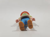 1992 Geobra Playmobil Girl with Blonde Hair Red Bonnet in White and Green Top and Blue Pants 2 1/8" Tall Toy Figure