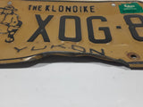 1989 Yukon The Klondike Man Panning Gold Themed Yellow Metal Vehicle License Plate Tag X0G 8