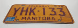 1976 Manitoba Yellow With Dark Red Letters Metal Vehicle License Plate Tag YHK 133