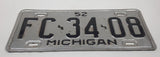 1952 Michigan Silver with Black Letters Metal Vehicle License Plate Tag FC 34 08