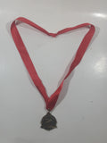 Canadian Outback Adventures Brass Medal Award with Red Ribbon